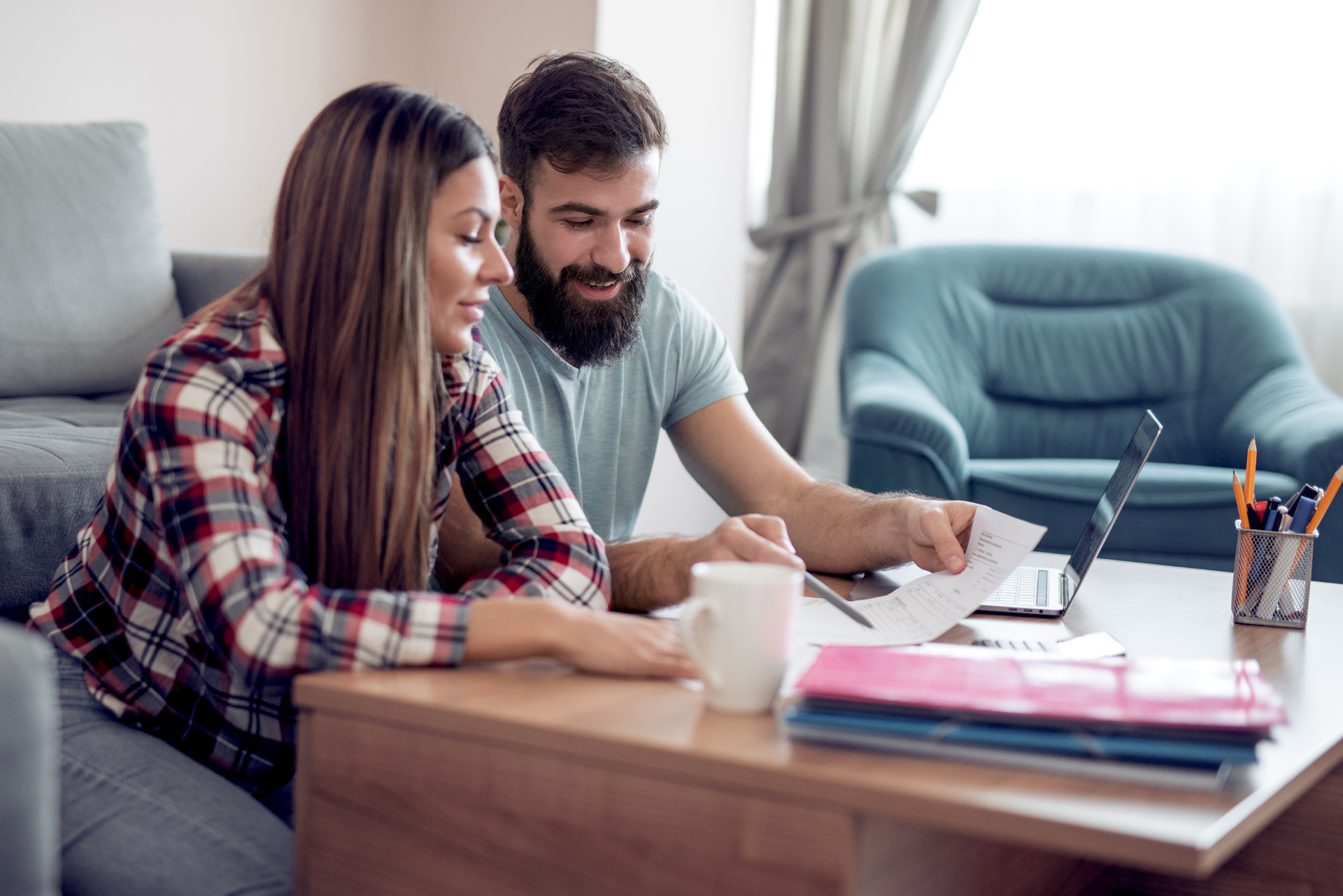 A couple at their coffee looking to budget their bathroom remodel.