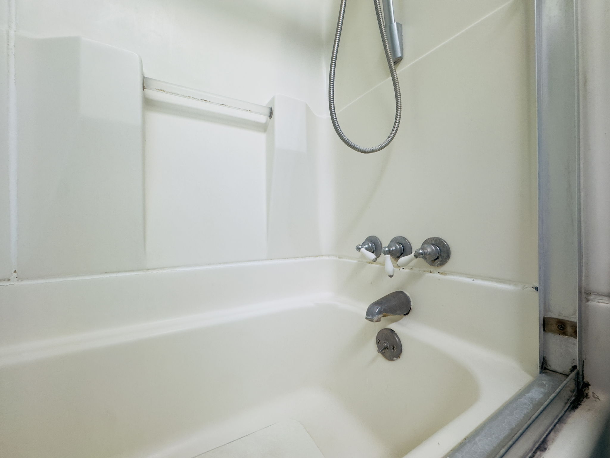 A dirty fiberglass tub