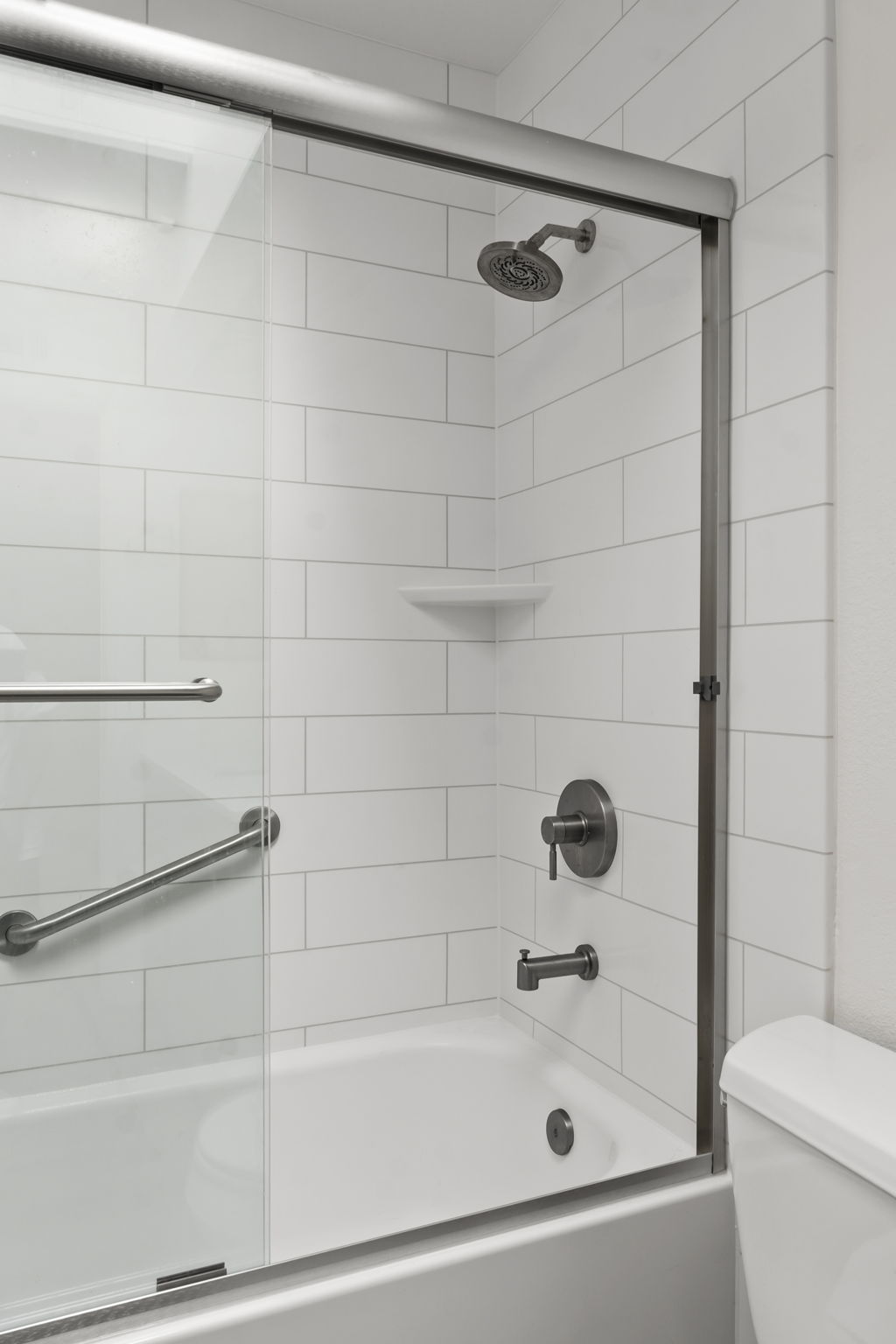 Fairfield walls, new bathtub, and chrome fixtures.