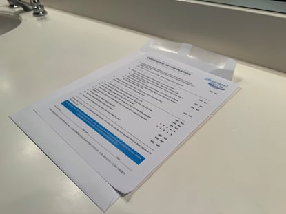 Shugarman's Bath Certificate of Completion on top of a counter.