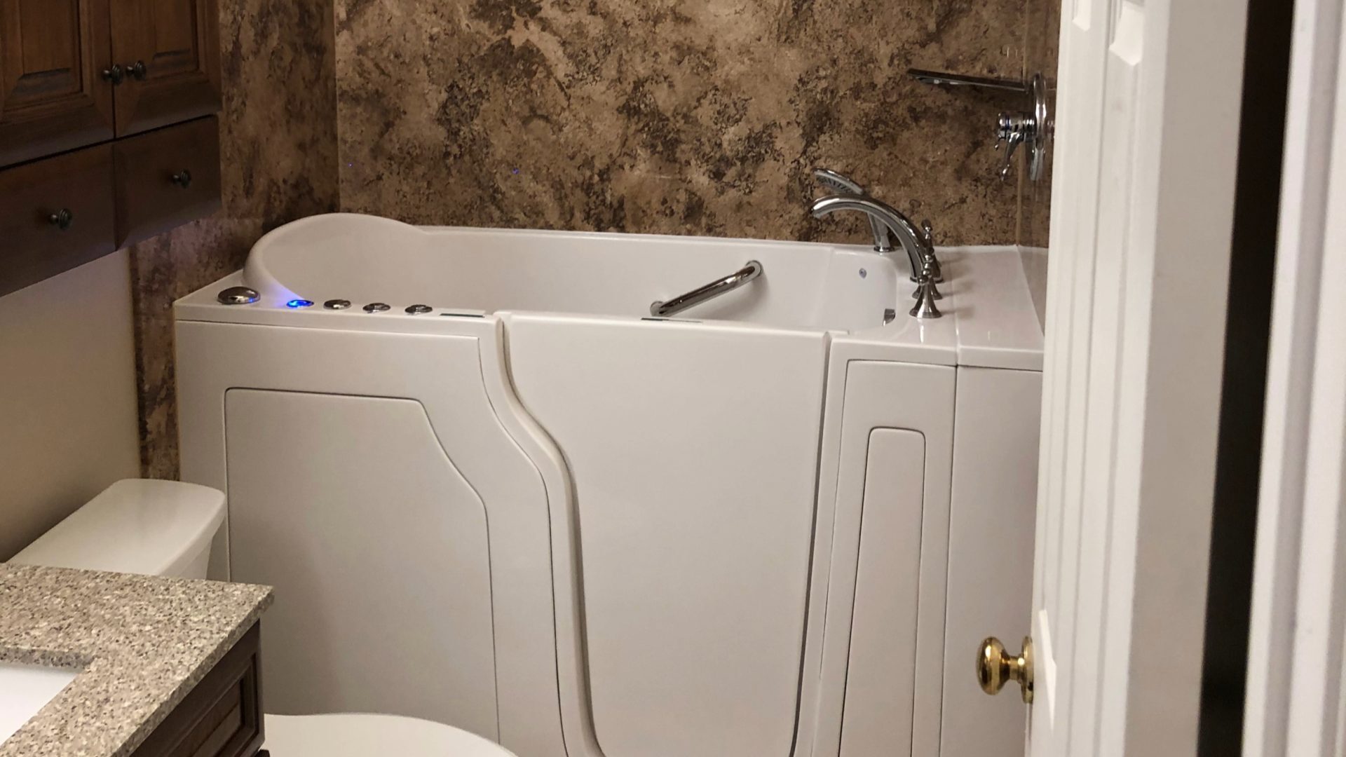 A bathtub remodel with a walk-in tub