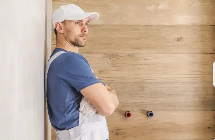 A man leaning on a wall