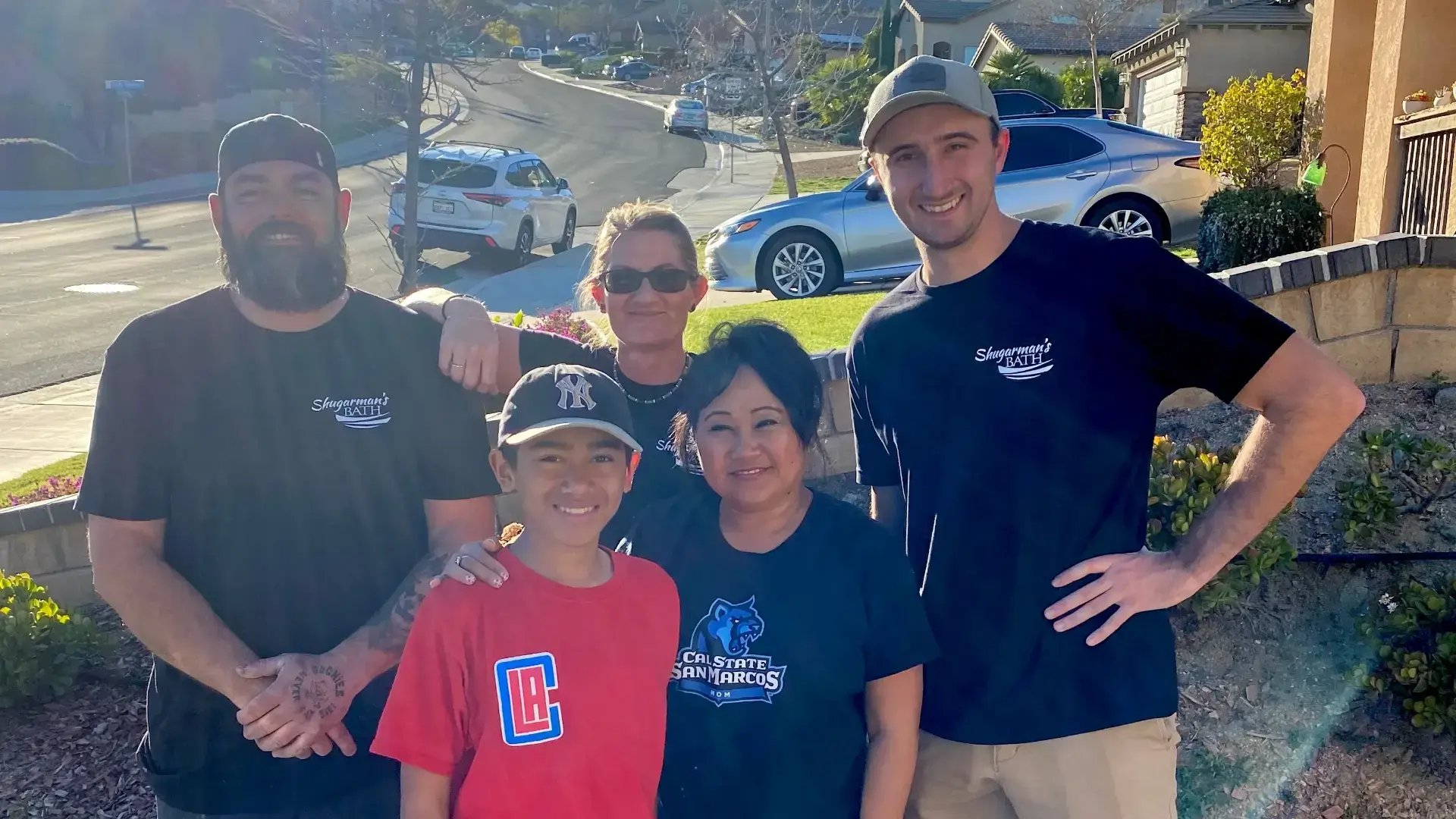 Five people posing for a picture