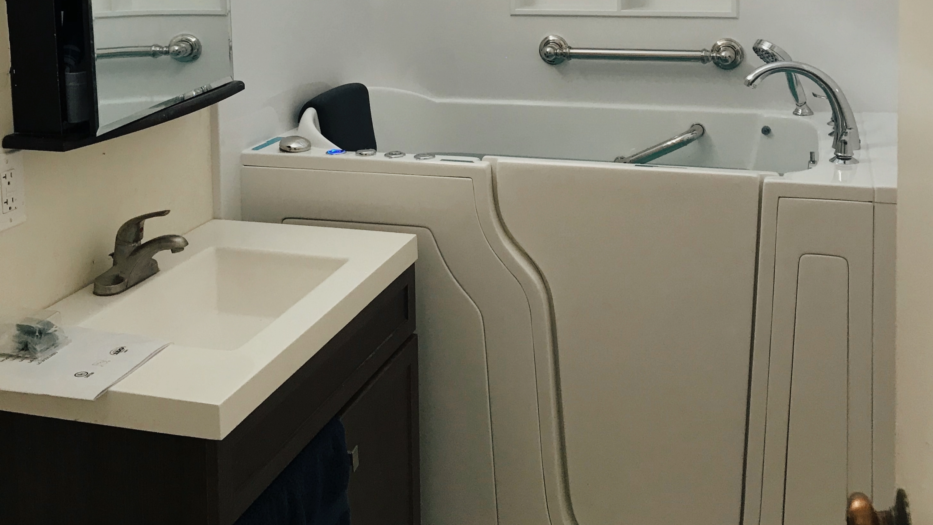 A bathroom with a walk-in tub