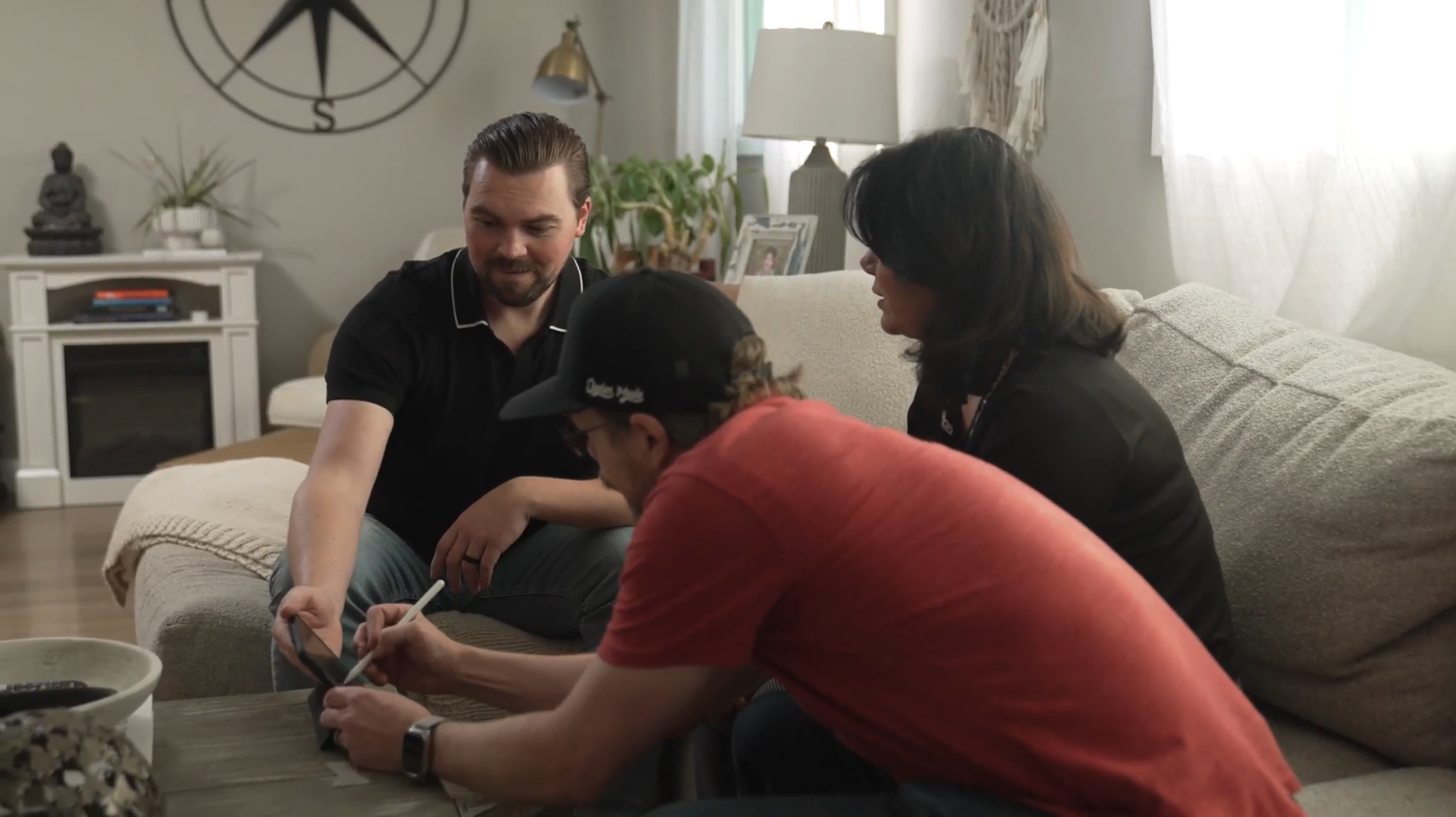 A customer signing a digital contract during a design consultation.