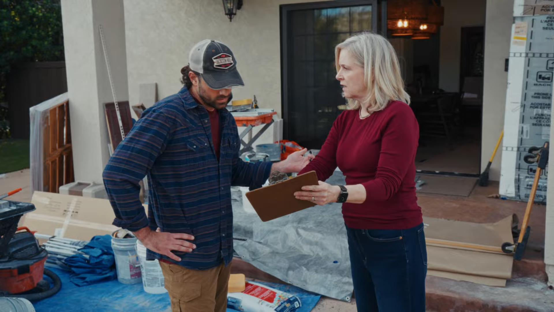 A customer is negotiating with a contractor about their shower remodel cost.