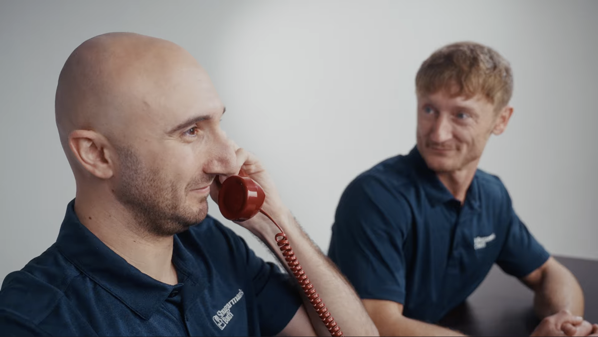 Chase Shugarman, as part of the Scheduling Team for Shugarman's Bath, answering the phone.