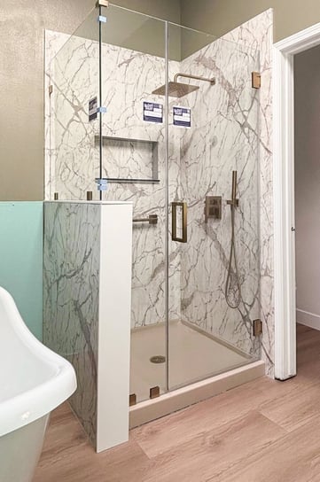 A shower enclosure with clear glass