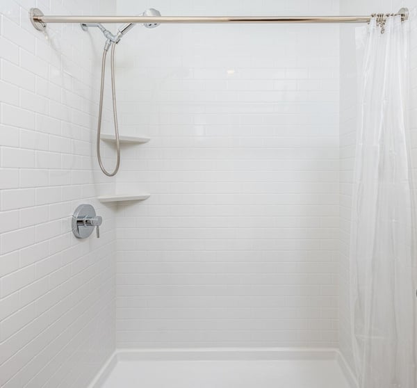 A new shower with a while simulated tile pattern wall