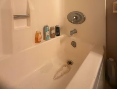 A stained fiberglass tub