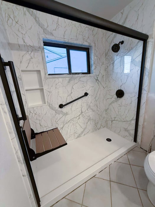 A new shower installed with a composite folding shower seat