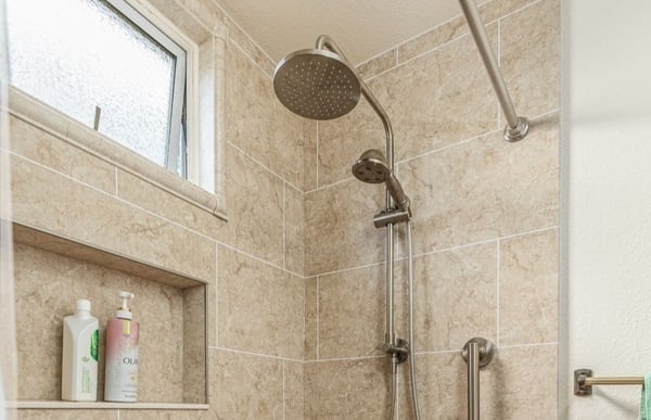 A brushed nickel shower head